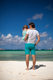 Father and his little daughter at tropical beach