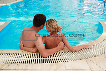 loving couple in the water pool