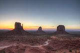 Monument valley holiday destination backlit by sunrise