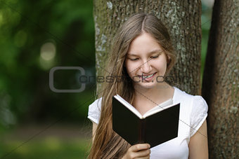 young girl reading book