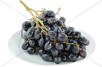 black  grapes on plate