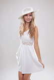 Young woman wearing a white dress 