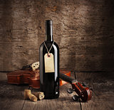 Red wine bottle and violin