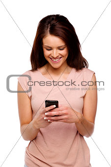 Brunette woman texting on a mobile phone