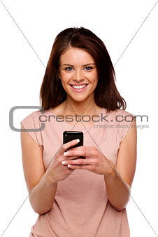 Brunette woman texting on her mobile phone