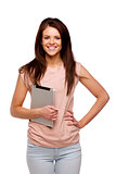 Brunette woman carrying a computer tablet