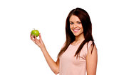 Brunette woman holding up an apple