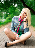 Young blond girl listening music