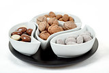 almonds in chocolate and walnuts on white