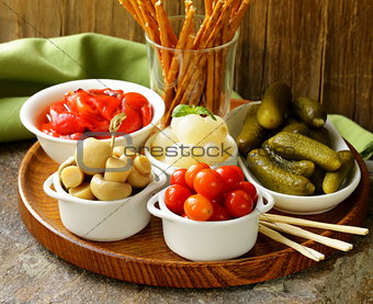 pickled snacks (tapas) - mushrooms, tomatoes, cucumbers and pearl onions