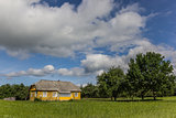 Yellow wooden house in Aukstaitija National Park