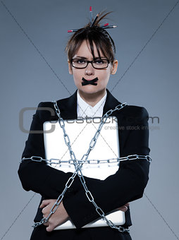 business woman chained to her  her computer laptop
