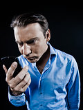 Man Portrait Angry looking at telephone videophone smartphone 