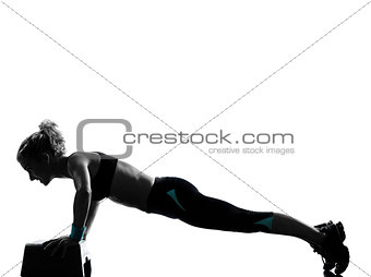 woman exercising step aerobics push ups fitness workout