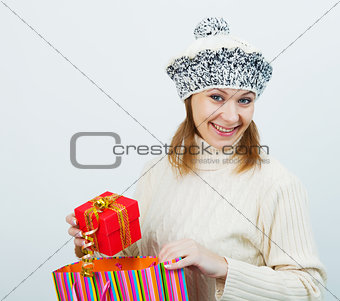 attractive girl in a sweater holding a gift