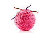 Pink yarn ball and crotchet hooks