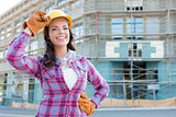 Young Attractive Female Construction Worker Wearing Hard Hat and