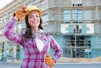 Young Attractive Female Construction Worker Wearing Hard Hat and