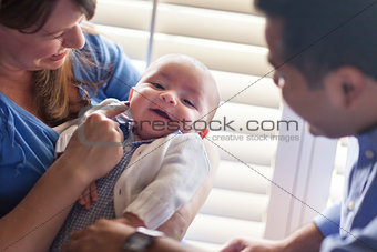 Mixed Race Couple Enjoying Their Newborn Son