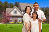 Small Hispanic Family in Front of Their Home