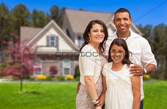 Small Hispanic Family in Front of Their Home
