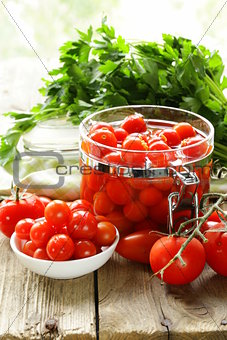 snack tomatoes pickled with herbs and spices
