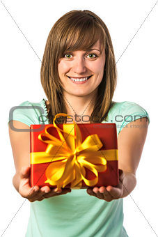 Happy young girl holding present