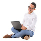 Excited Asian male using laptop