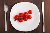 Small cherry tomato on a plate