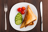 Grilled sandwich with vegetables on plate