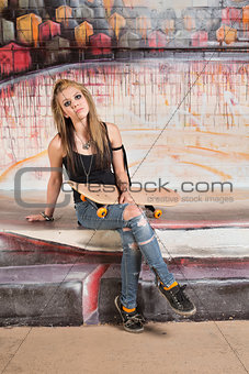 Young Woman Holding Skateboard