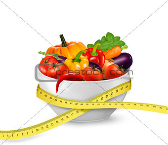 Diet meal. Vegetables in a bowl with measuring tape. Concept of 