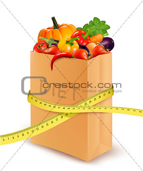 Fresh vegetables in a paper grocery bag with measuring tape. Con