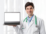 doctor holding a laptop with blank screen
