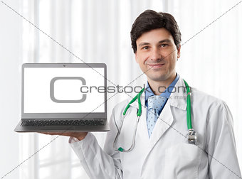 doctor holding a laptop with blank screen