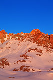 Sunrise in snow mountains