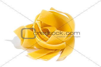 Raw pasta tagliatelle isolated on white
