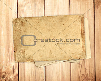 Old card on wooden planks