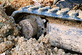 Closeup of digger's tracks in mud
