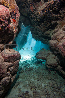 Cave in underwater tropical reef