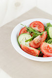 served plate with mix salad from tomatoes and cucumbers