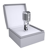 Old microphone in open gift box