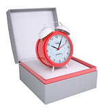 Alarm clock in open gift box