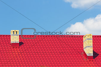 Red roof with chimneys