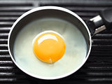 frying egg on a grill