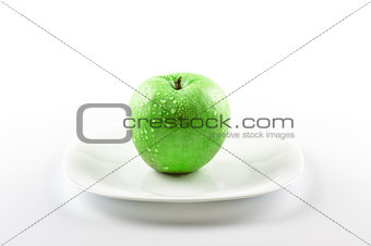 green apple on white dish