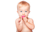 Cute baby with food spon in mouth