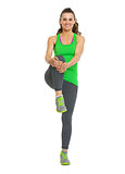 Happy healthy young woman stretching