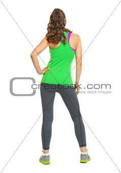 Full length portrait of fitness young woman . rear view