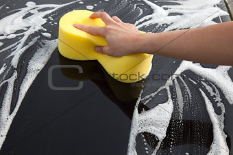 Washing a car with a lot of foam